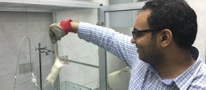 Ali, ONE Lab RA, holding the rat during the test Ali, ONE Lab RA, holding the rat during the test